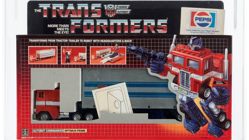Hasbro G1 Transformers Optimus Prime figure in its original packaging with a promotional Pepsi sticker on it.