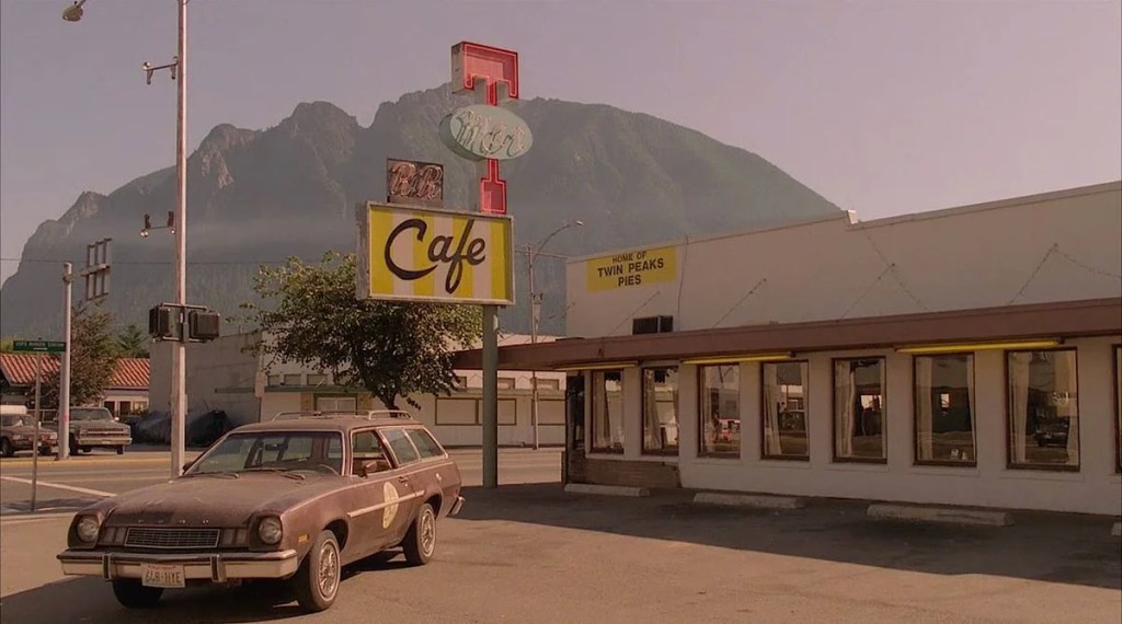 The Double R Diner and the mountains behind the town in Twin Peaks.