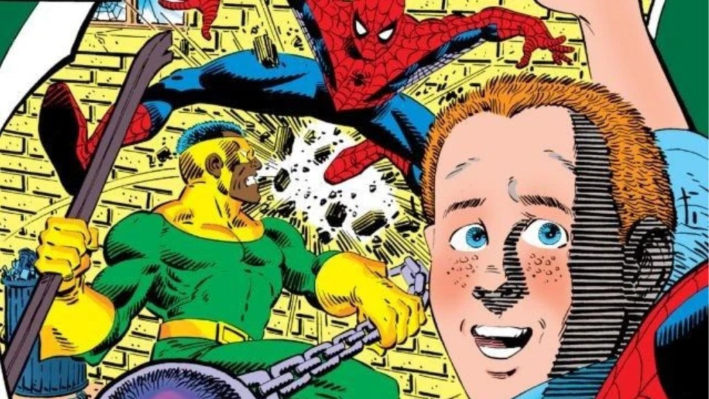 A boy holding a poster with Spider-Man fighting a member of the Wrecking Crew