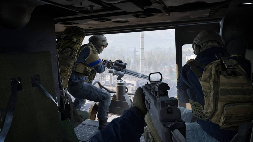 Wardogs player in a helicopter with teammates