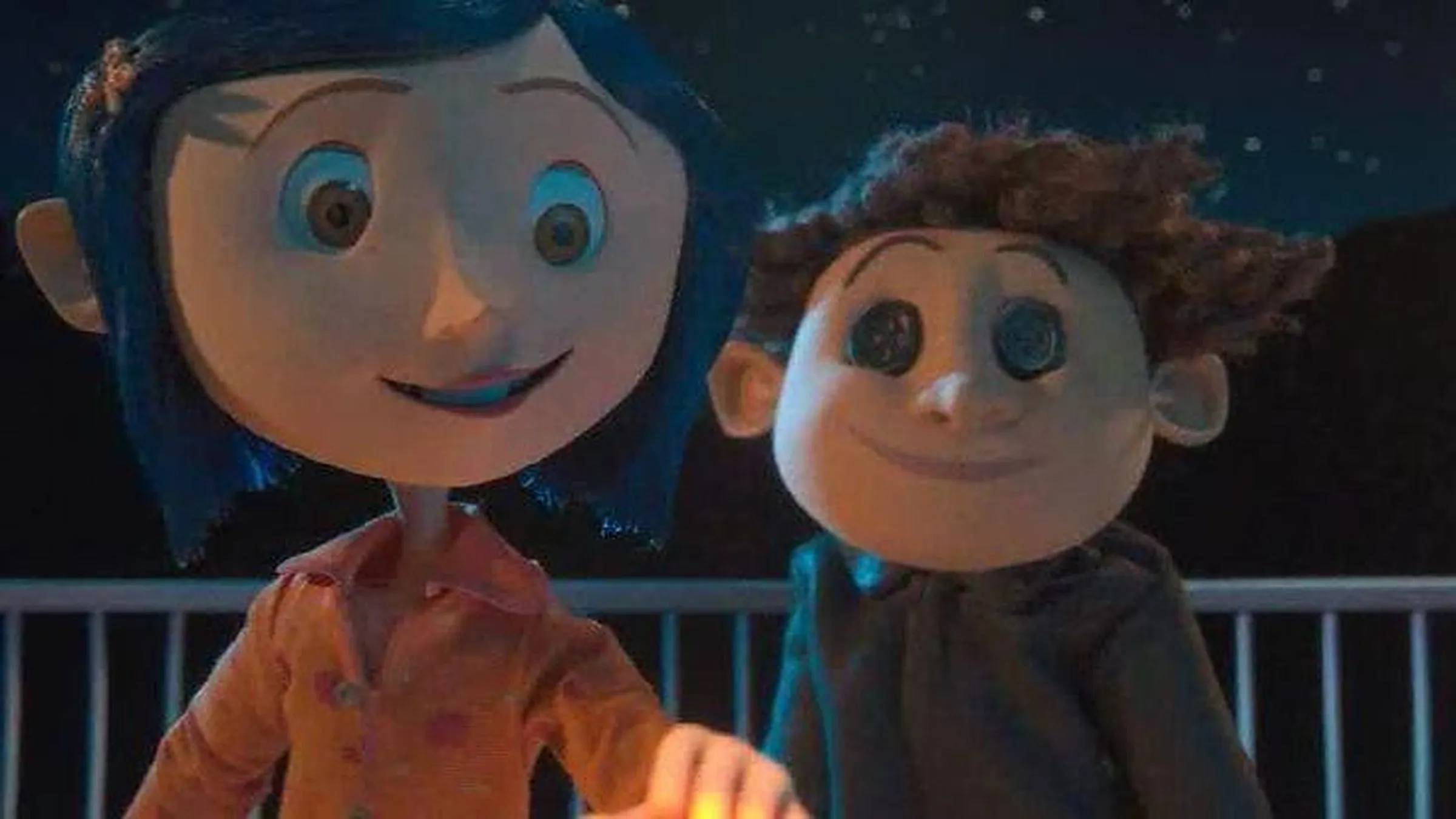 Coraline Jones sits beside the Other Wybie in Coraline