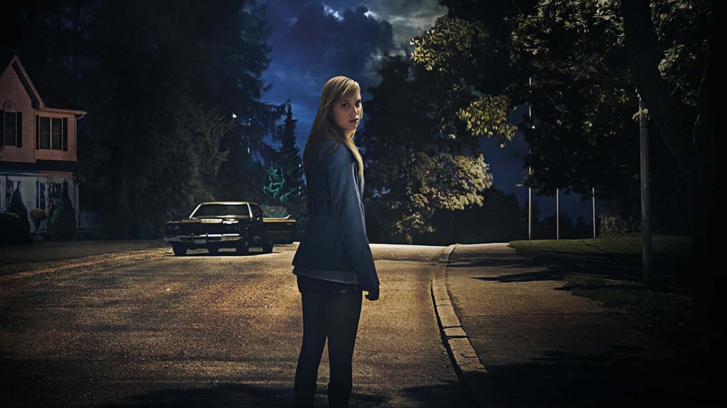 Maika Monroe on the poster for It Follows