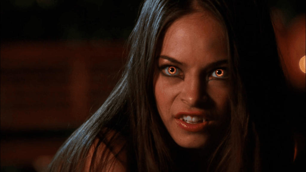 Lana Lang with cat eye makeup and light up orange eyes, Smallville episode "Thirst" from Season 5