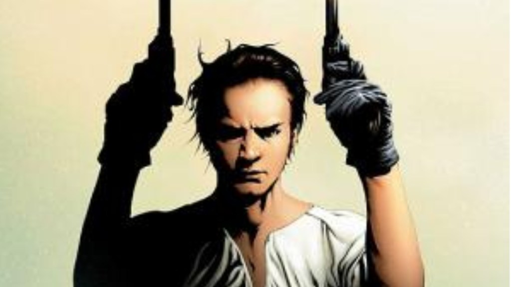 Young Roland holding up the sandalwood revolvers